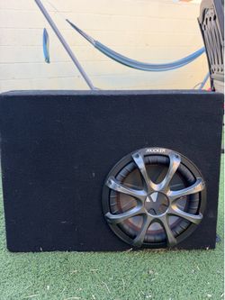 This is a Kicker Comp / Kicker subwoofer in a Ground Shaker box
