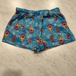 Hatchimals Blue shorts with colorful cartoon print. Elastic waistband.