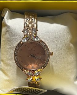 Female invicta watch gold