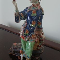 Chinese porcelain lady figurine, likely a modern collectible piece inspired by the Qing Dynasty 