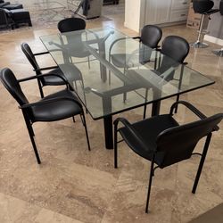 Rectangular Dining Table & 6 Black Leather Chairs. Glass Top 39” x 79”. East Boca In Library Commons. 