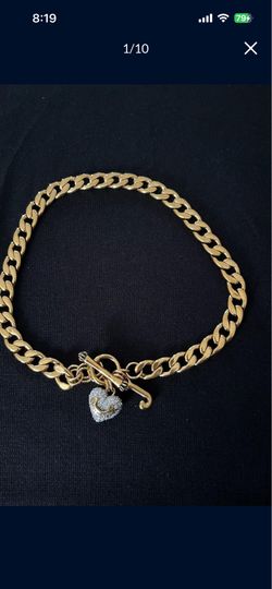 It’s A Beautiful necklace made by juicy couture. It is for women’s.
