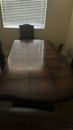 Dark Wood Dining Table with Carved Edge