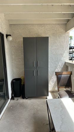 Tall Gray Storage Cabinet with Four Doors