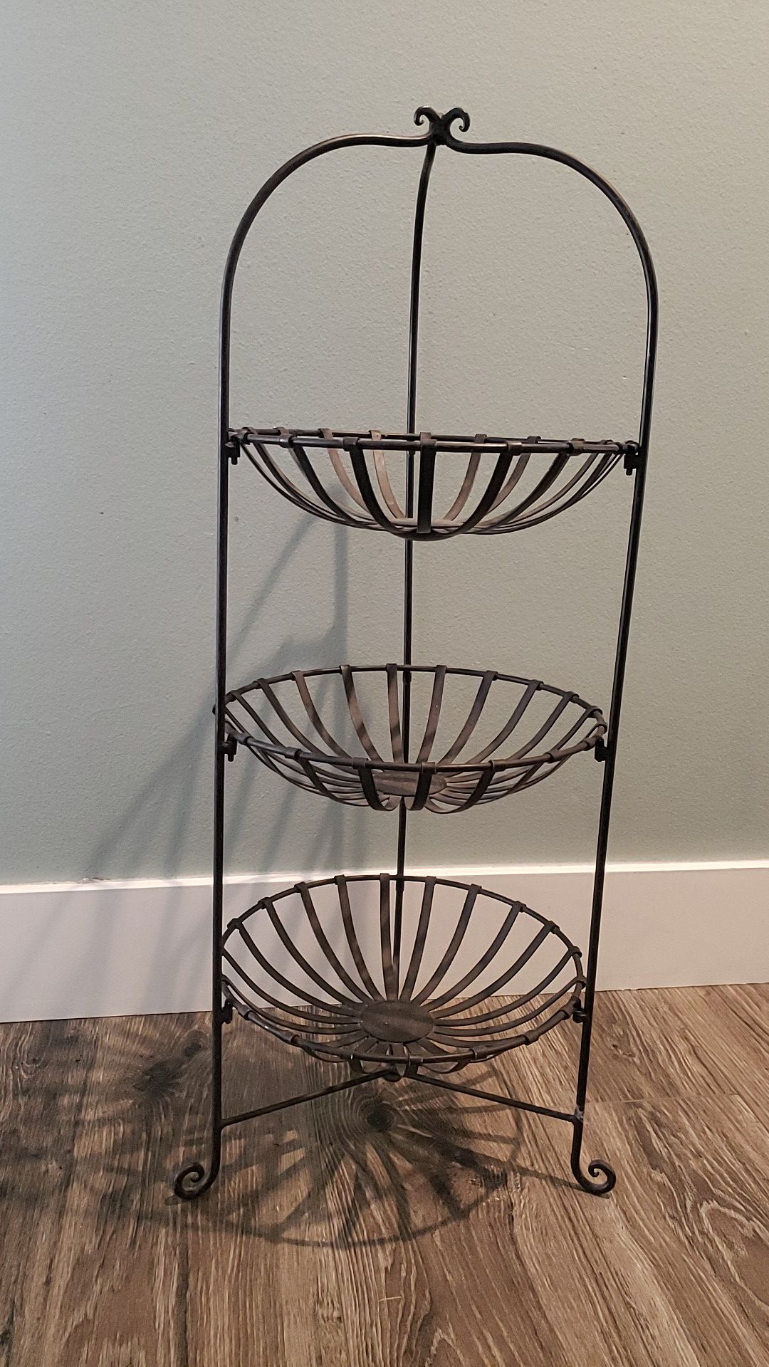 Metal 3 tiered basket shelves. Approx. 32 inch tall