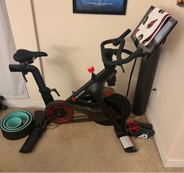 Peloton Bike with shoes and mat
