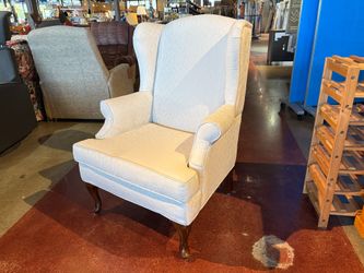 Queen Anne Style Wingback Chair with a Cream Floral Print