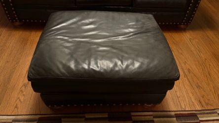Black leather furniture set. Ottoman, chair, and couch.
