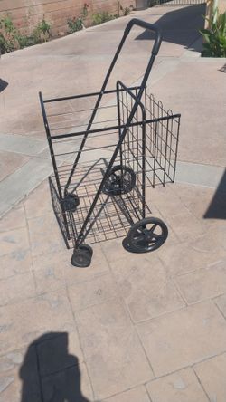 LARGE BASKET WITH EXTRA WHEELS IN FRONT AND MORE CARRING SPACE ON BACK GOOD CONDITION IS FOLDABLE