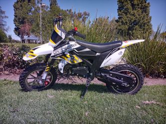 **Brand New Dirt Bike for Kids and Adults** -50cc engine. -Automatic. -2 stroke engine. -Speed governor. -Support up 200 pounds. -Mph 35. **High perfo