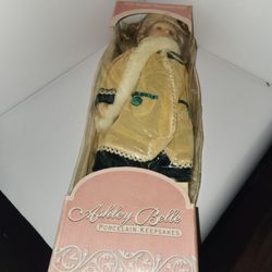 New In Box Ashley Belle 16" Doll Number 074-17-518 with yellow coat green velvet dress