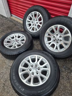 Chevy silverado or gmc wheels. Good tires