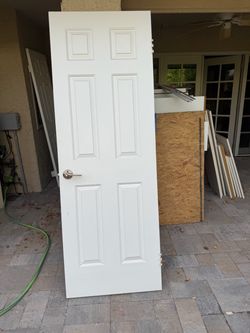 Solid wood door with hardware