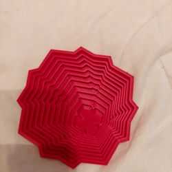 Red fidget toy.