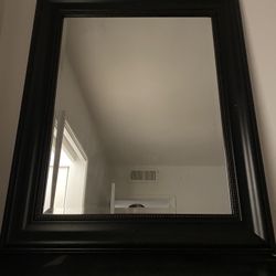 Immaculate condition, striking large black mirror.