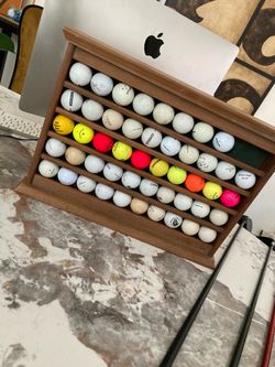 Golf balls w ball w small shelf to store