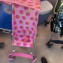 strawberry Folding Stroller, Used One Time Pick Up Is Near Coors And Rio Bravo Price Is Firm