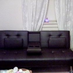 Brown leather Couch/Futon