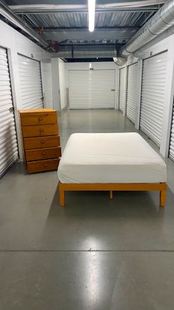 Full size bed frame with mattress and dresser