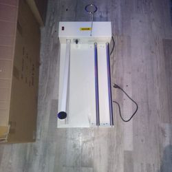 Shrink wrapping machine.