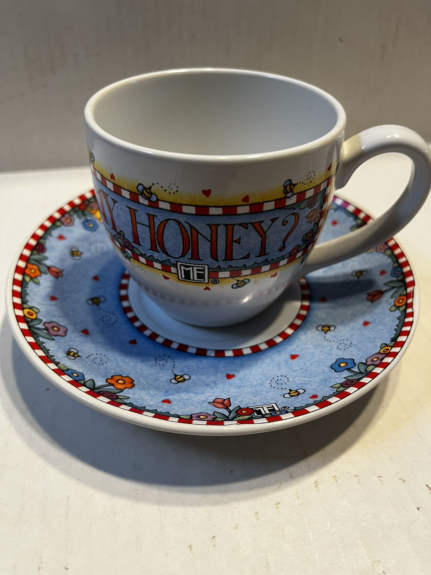 Mary Engelbreit Cup And Saucer .