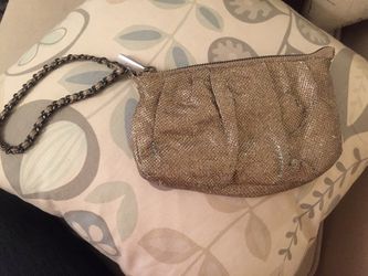 Express shimmery gold wristlet.