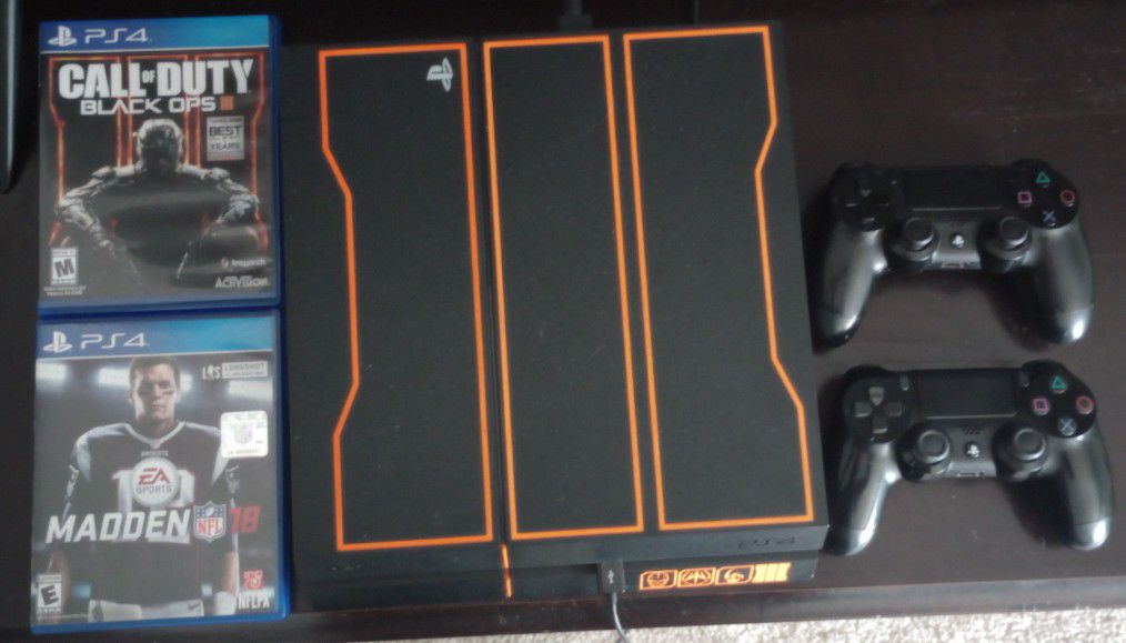 PS4 with Call of Duty Black Ops 3, MADDEN 18 & 2 controllers.