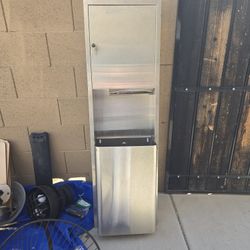 commercial stainless steel recessed paper towel dispenser and waste receptacle. 