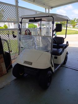 E-Z-Go four-seater golf cart