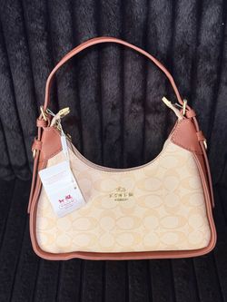 New Women’s Twisted Sheri Coach Purse.