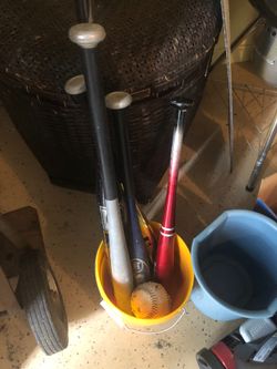 Sports equipment baseballs bats basketball football