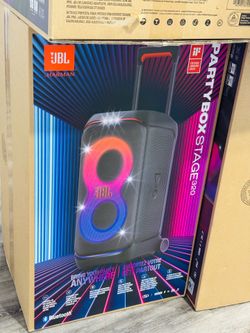 Powerful JBL PartyBox Stage 320 portable party speaker. It has JBL Pro Sound, adaptive lightshow, and splashproof design. Speaker has telescopic handl