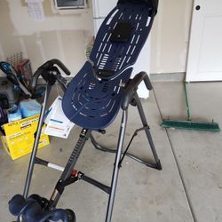 Teeter back pain relief