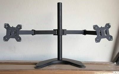 Dual monitor stands. Can hold up to 32 inches