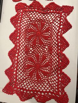 Crocheted red Doilies