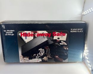 vintage Hide-away Safe box featuring a black