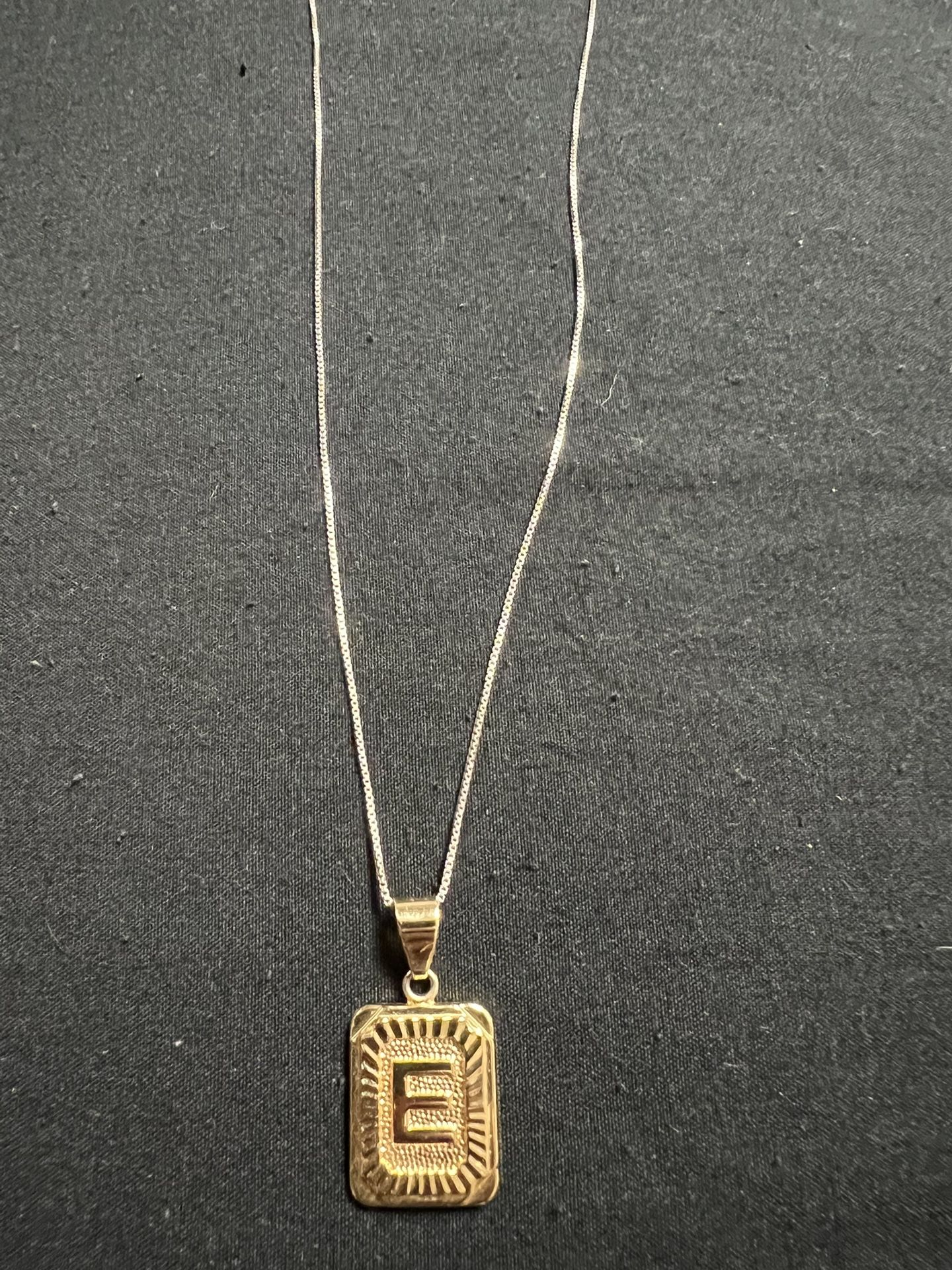 Gold Pendant and Silver chain 