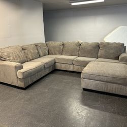 (DELIVERY AVAILABLE!!)  4 piece grey ashley furniture sectional W/ STORAGE OTTOMAN!!