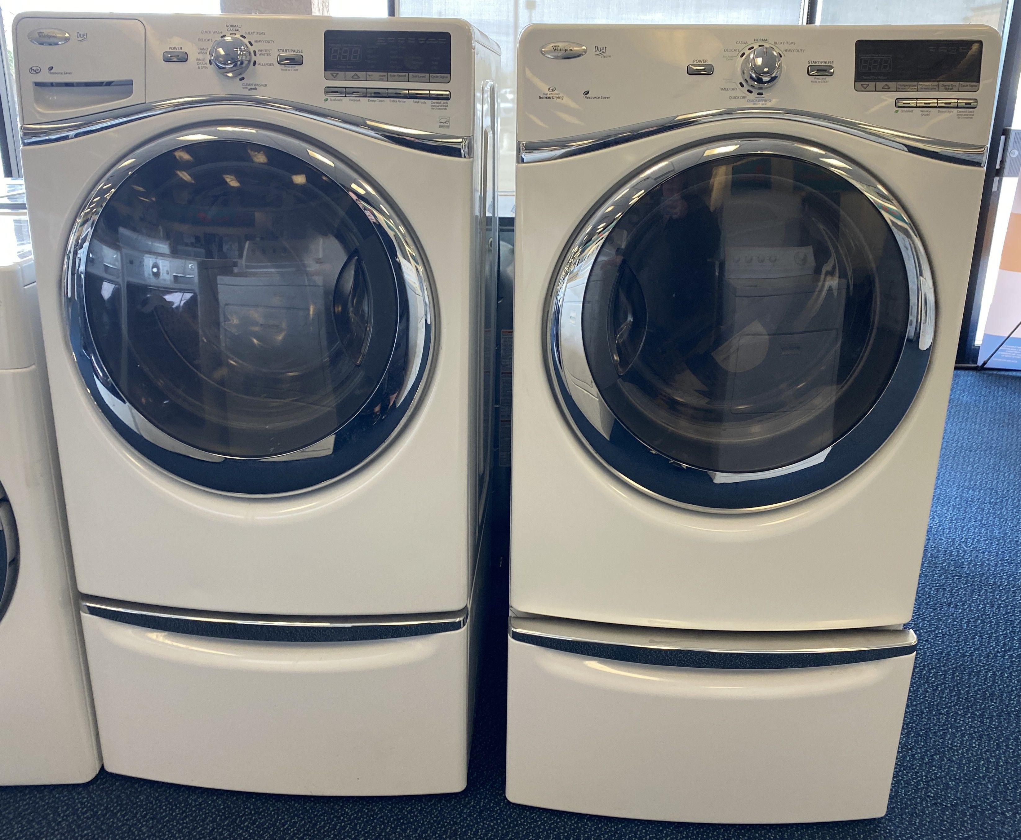 White Whirlpool Duet Front Load Washing Machine and Gas Dryer Set on Pedestals (0-0007)