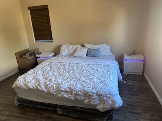 California king bed with two nightstands, a dresser, and 55 inch TV California king bed with two nightstands, a dresser, and 55 inch TV