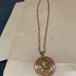 14k gold figaro chain with 14k double sided jesus pendant