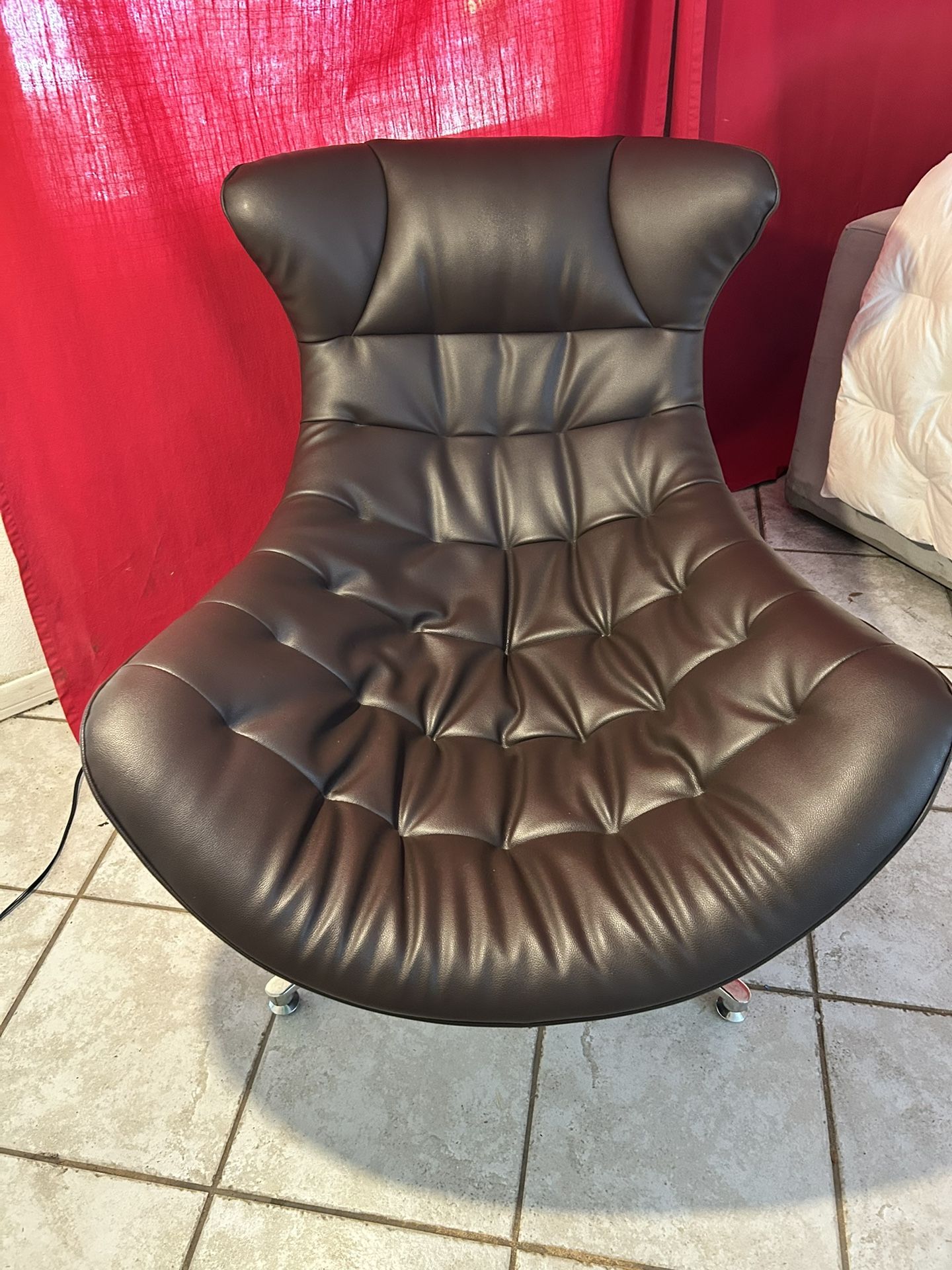 Brown leather relax Cocoon armchair.