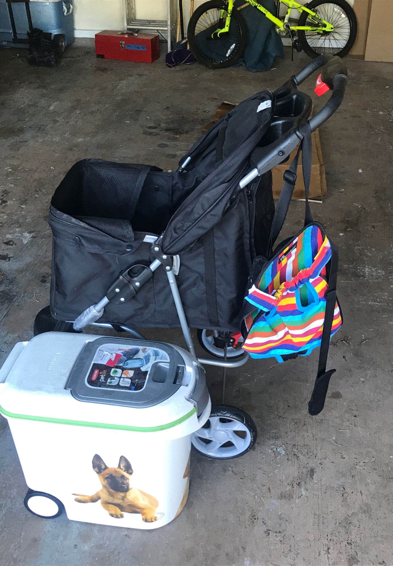 Dog stroller, food holder, and carrier.