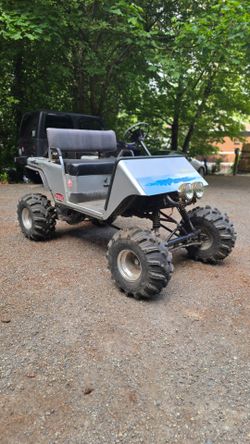 Lifted ezgo golf cart with yamaha 700cc 2 stroke engine