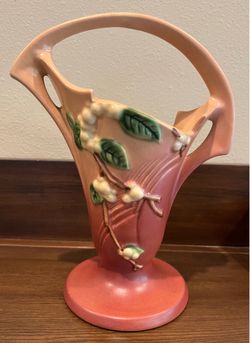 vintage Roseville Pottery "Snowberry" pattern handled basket vase in dusty rose, manufactured around 1947.