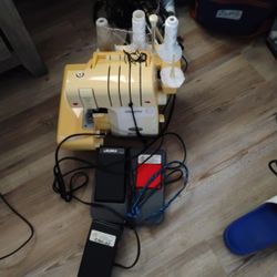 Portable Sewing Machine With Foot Puddle