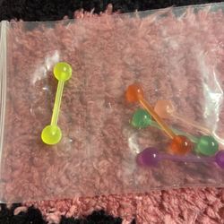 Brand new set of tongue rings, medium/large five piece set
