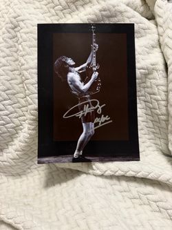 Autographed ac/dc angus young picture