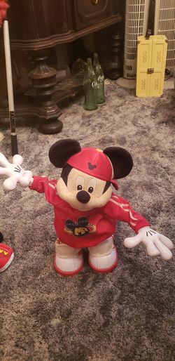 Mickey mouse. Two dancing dolls.