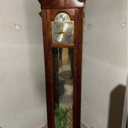 Grandfather clock with curio by Howard Miller